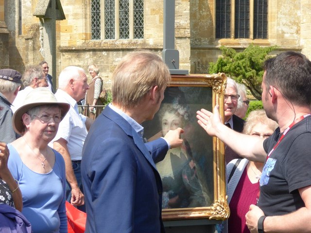 Portraiture expert Philip Mould pointing at painting in 2016 photo