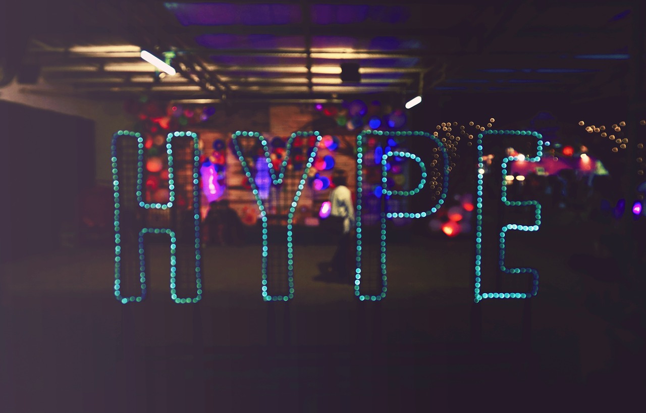 Nighttime photograph with the word 'HYPE' spelled out in teal lights